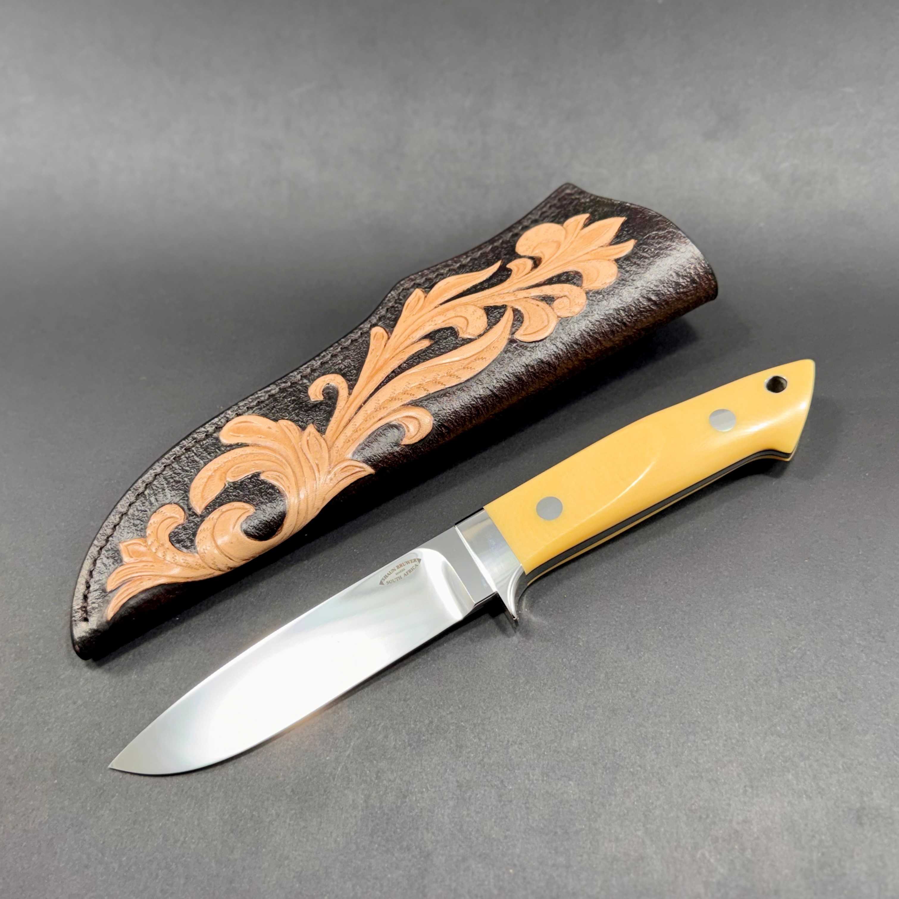 Loveless 5-inch drop point in Bohler N690 stainless steel with 303 stainless fittings and vintage Westinghouse ivory linen micarta