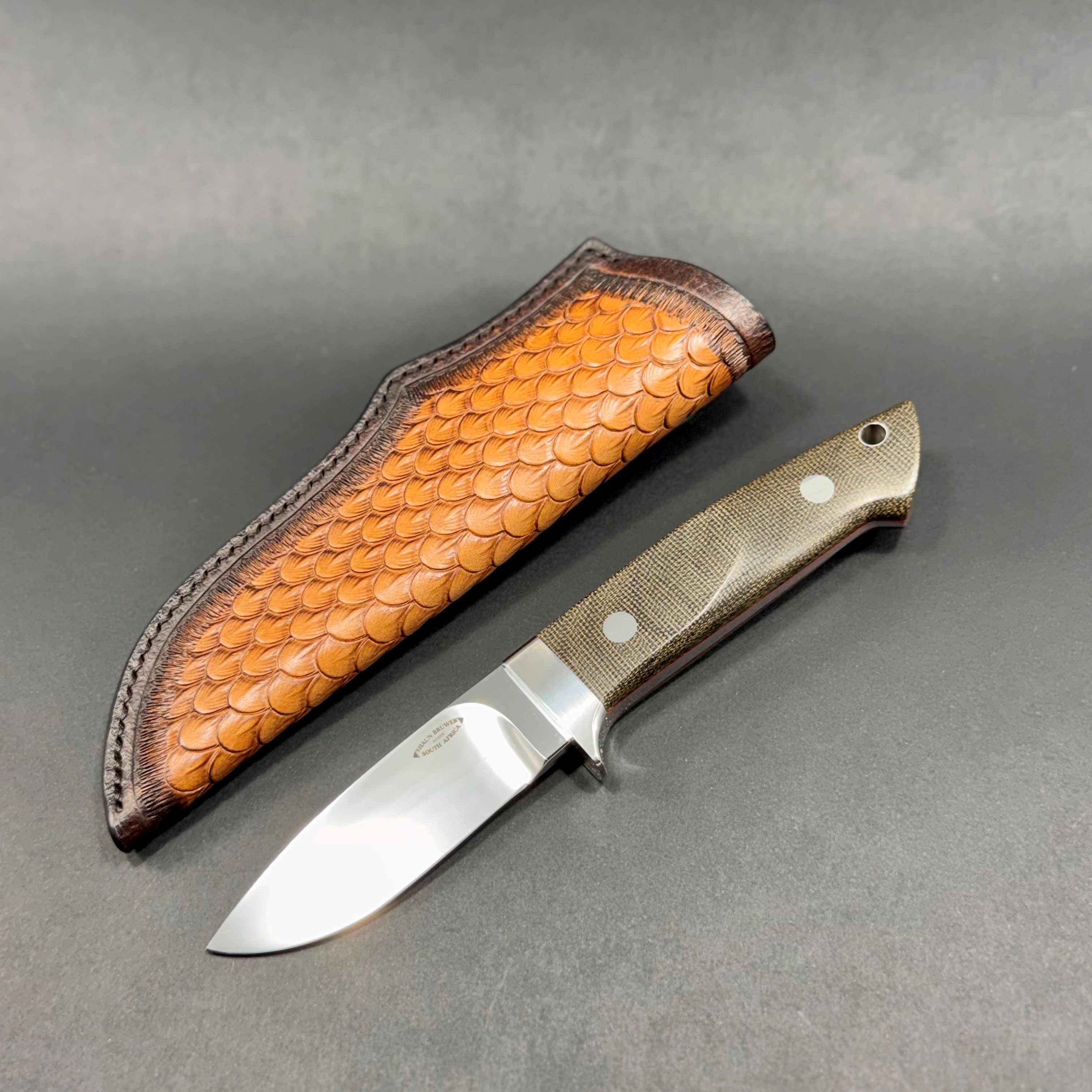 Loveless 4-inch drop point in Bohler N690 stainless steel with 303 stainless fittings and OD green micarta