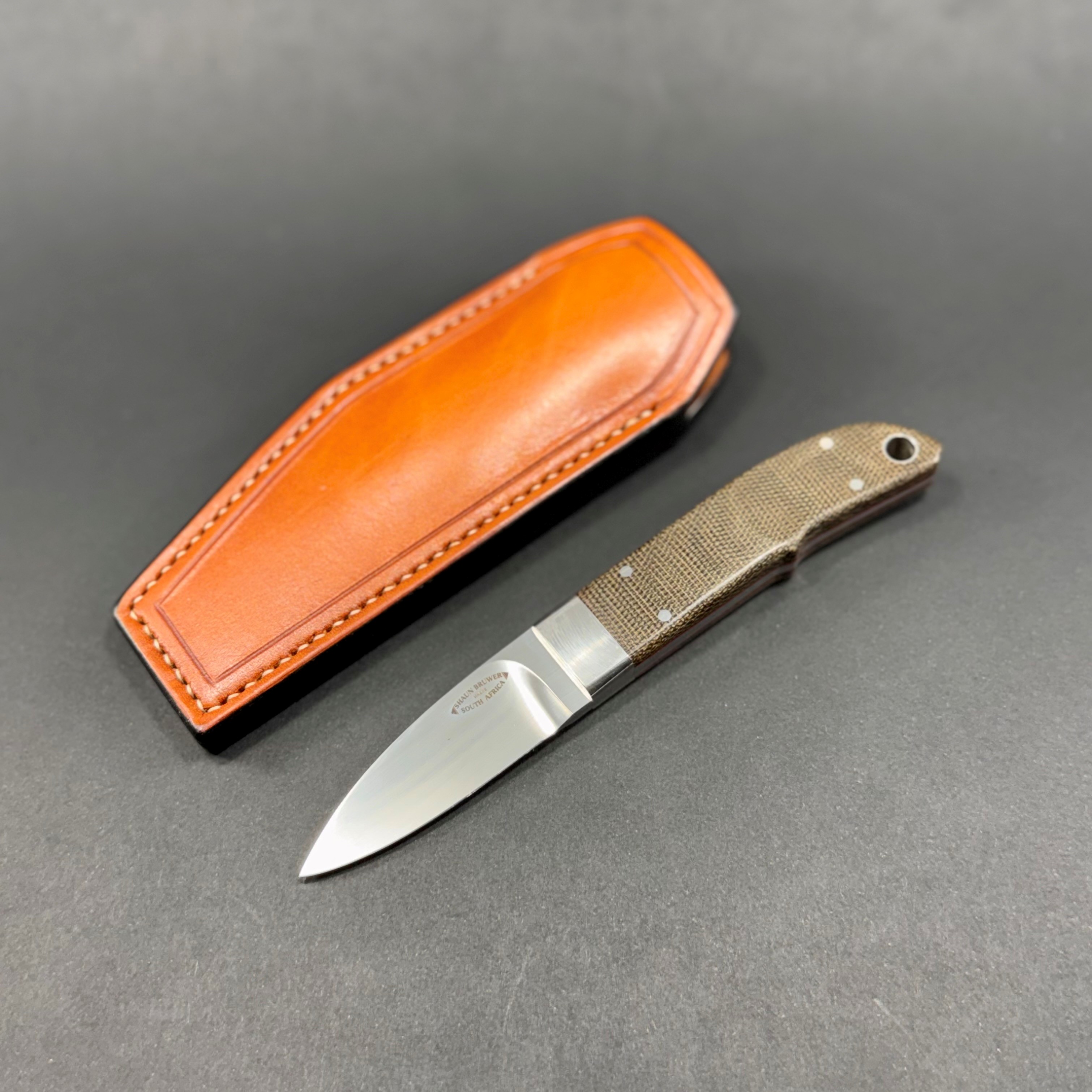 Loveless city knife in ATS34 stainless steel with 303 stainless fittings and OD green canvas micarta