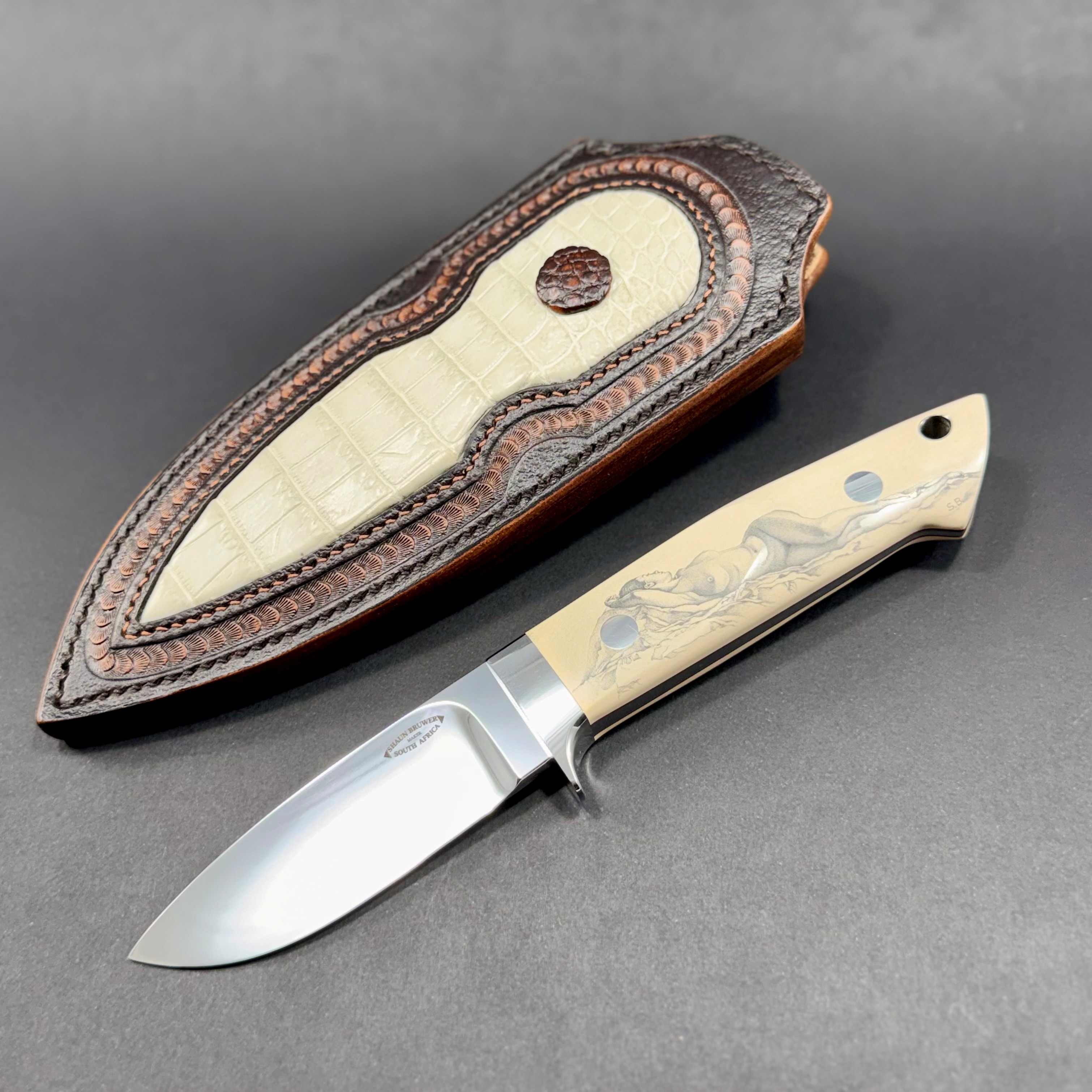 Loveless 4-inch drop point with paper ivory micarta, 303 stainless fittings, and custom scrimshaw
